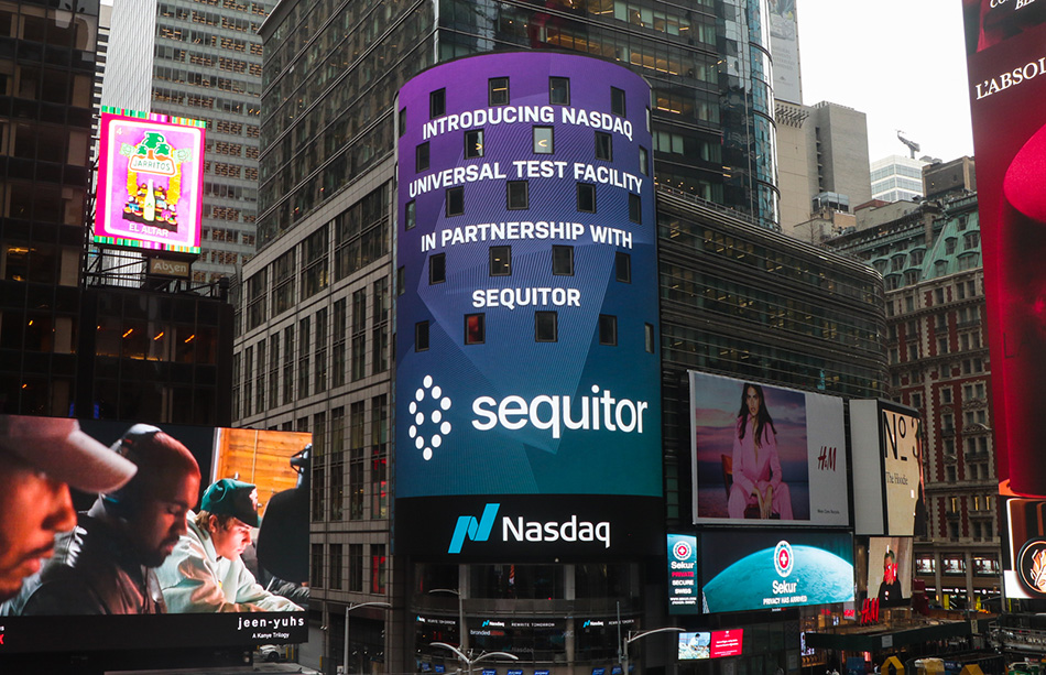 An electronic billboard displays the Nasdaq logo alongside the logo of Sequitor, one of their esteemed partners and customers, showcasing a vibrant collaboration in the realm of technology and finance.